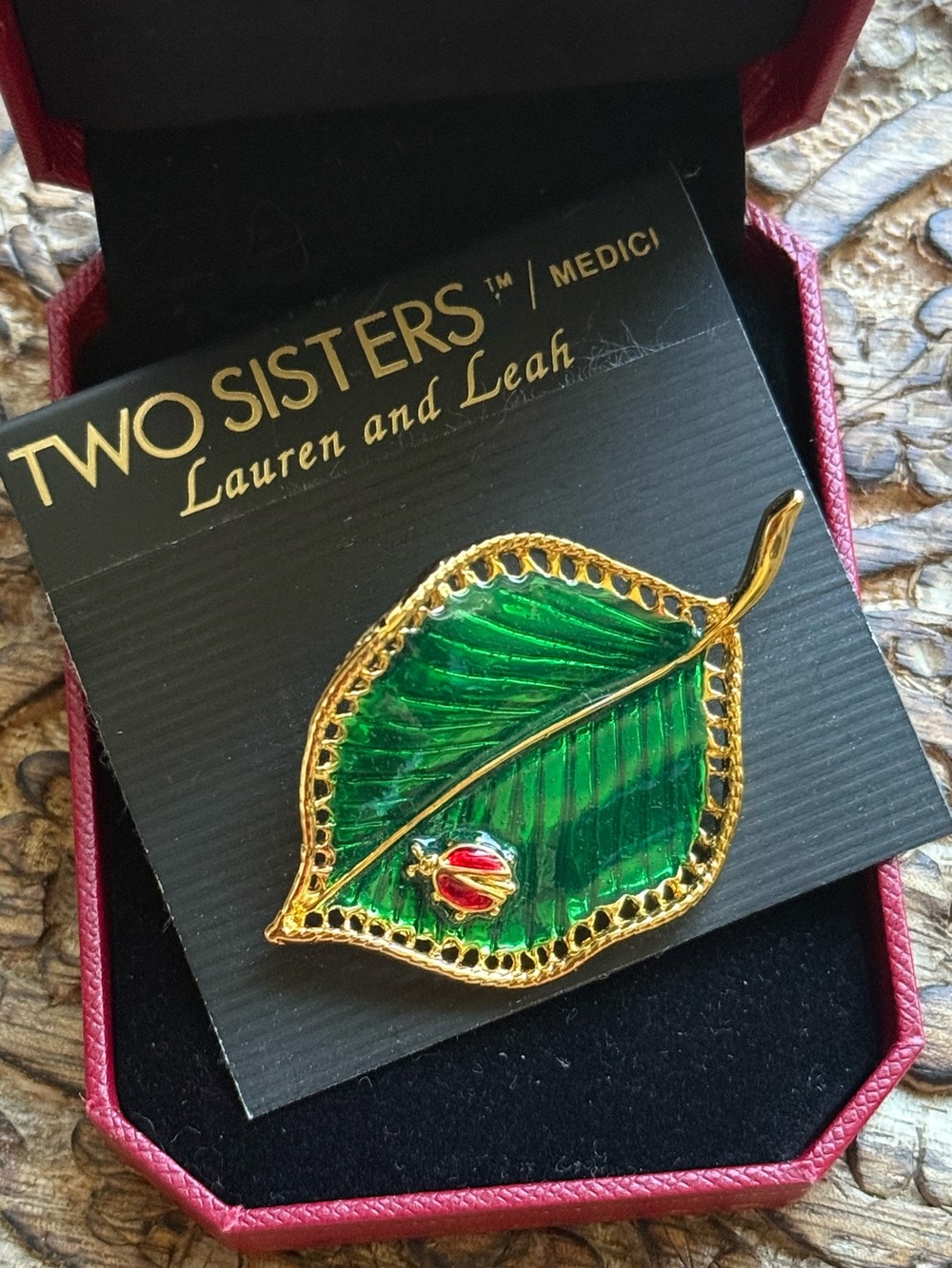 Two sisters leaf brooch with enamel